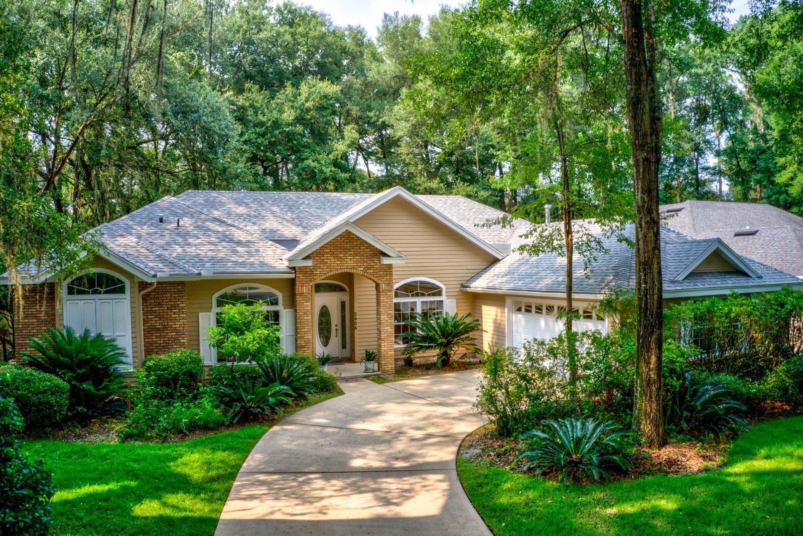 One or more photo(s) has been virtually staged. With its lush green landscaping, this 5 bedroom / 3 bathroom home has really great nice curb appeal. Located in the Katelyn Lane subdivision of Haile Plantation. This home is located just 60 yards from Lawton Chiles Elementary School, one of the best elementary schools in Alachua County.! Inside you will find Golden Oak Wood floors throughout the common areas and kitchen and new luxury carpet in the bedrooms. The kitchen boasts all new Appliances, Granite Countertops, walk-in pantry and plenty of cabinets for storage, plus a breakfast area. Outside you and your loved ones can enjoy cool evenings playing basketball on the 1/2 court in the backyard! There is a brand new roof, a brand new Trane A/C will be installed prior to closing, and the house is freshly painted inside and outside. The Haile Plantation Community has much to offer! Optional membership provides access to the amazing golf course, the pool, tennis courts, club house. Haile Plantation has fantastic biking and walking trails, a Publix in Haile Market Square, and the Saturday morning Farmers Market in the nearby Haile Village Center.