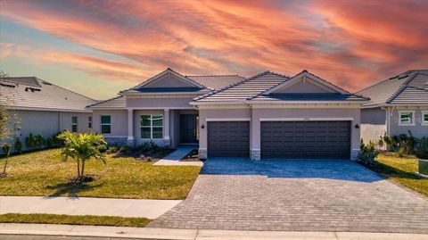 Photo of 7796 Lakes Edge Lane, Port Charlotte, FL 33981 (MLS # A4683376)