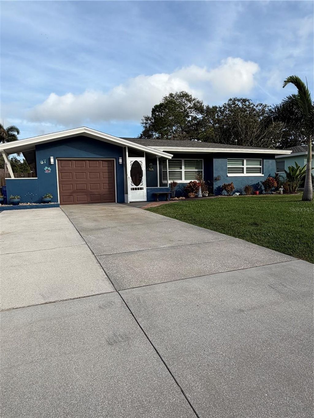 Photo of 87 Oakwood Drive, Dunedin, FL 34698 (MLS # TB8457793)