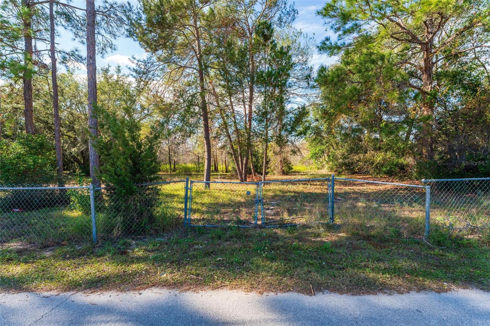 Spacious lot on Sunland Avenue offering endless possibilities for your dream home or investment property. Enjoy the peace and privacy of no rear neighbors, with nature as your backdrop. The property features dual gated access from Sunland Avenue, adding convenience and versatility. A small portion of wetlands sits in the northwest corner, leaving plenty of usable space for your vision. According to the seller, you have the flexibility to build or place a manufactured home making this lot a rare opportunity to create the lifestyle you’ve been looking for.