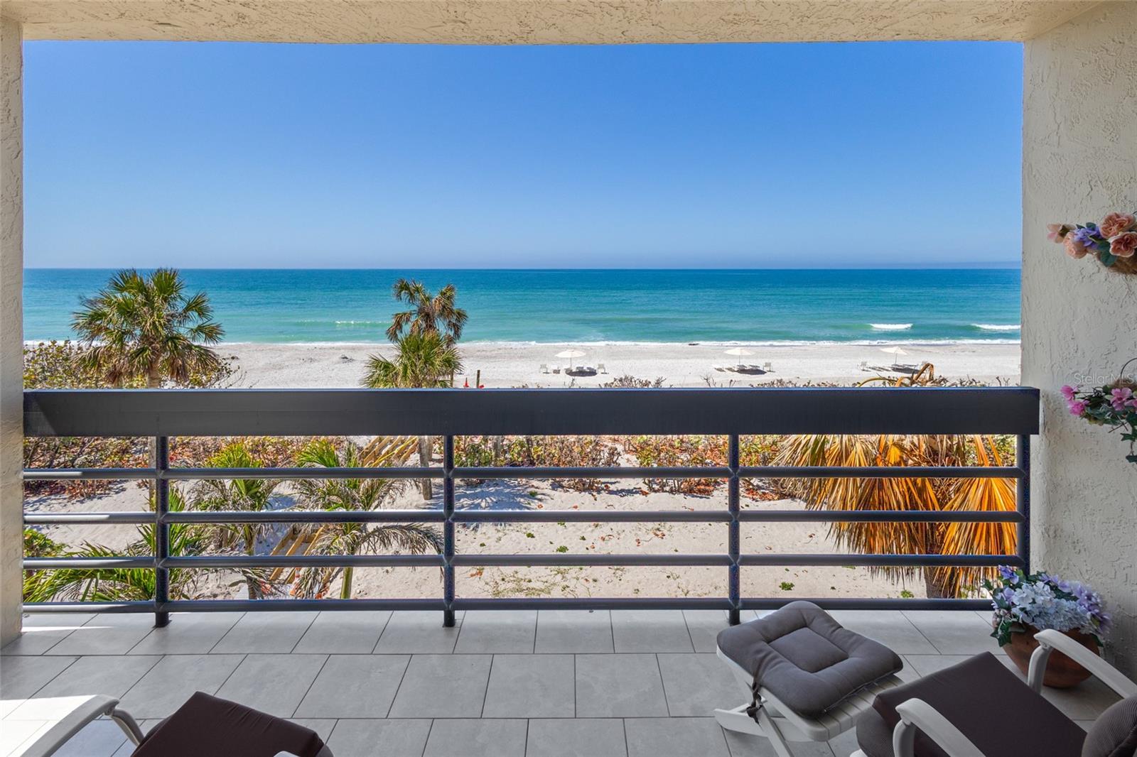 Seller is accepting Back Up Offers. This beachfront 3 bedroom corner residence checks all of the boxes! The azure gulf water is seen through Hurricane Impact Sliders/Windows from almost every room and provides the perfect backdrop for entertaining or simply relaxing on the wraparound terrace with a book enjoying the breeze and watching the sunset. The open kitchen offers state-of-the-art GE appliances for preparing memorable meals with the sun setting in the distance. The primary suite pampers owners with big water views, modern carpeting, access to the terrace, large walk-in closet, dual vanites and glass enclosed shower with bench. Visitors will be comfortable in either of the guest bedroom offerings, one of which has a 2nd terrace overlooking the golf course of the Longboat Key Club. Other highlights include TWO Parking Spots (one under building), a laundry closet in the kitchen, granite counters, ample storage and an excellent rental policy of 1 month minimum 12 X per year. Beachplace offers a 24-hour manned guard gate, heated swimming pool & spa, tennis courts, dedicated pickle ball courts, fitness center, clubhouse, on-site management, and miles of pristine beach to relax, enjoy and explore. Conveniently located on the south end of Longboat Key just minutes from the fine dining and shopping on St. Armands Circle and a short drive over the bridge to the cultural hub of downtown Sarasota.