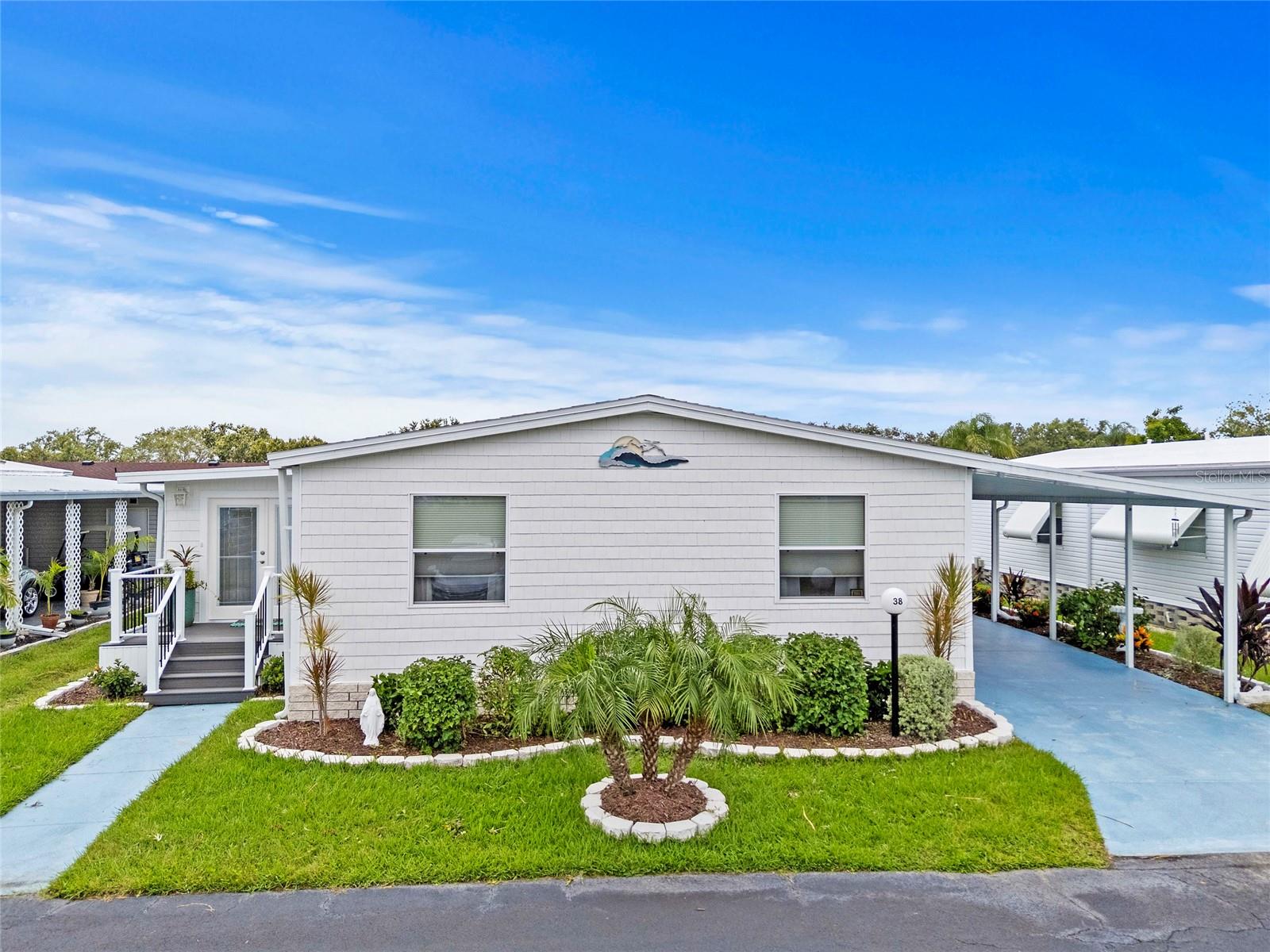 Seize this incredible opportunity to make your dream life a reality in a vibrant 55+ community! This exquisite home, brimming with delightful surprises and premium upgrades, offers the ultimate Florida lifestyle. From the moment you arrive, you're greeted by enchanting curb appeal enhanced by beautiful landscaping and a charming side porch—perfect for savoring your morning coffee or unwinding with an evening drink. Step through the inviting entryway into a spacious open floor plan that seamlessly connects the living room, dining room, and kitchen—creating an ideal space for unforgettable gatherings with family and friends. The kitchen is a chef's delight, featuring ample cabinet space, modern appliances, and a wealth of natural light. The expansive Florida Room adds even more versatility, providing a perfect spot for both entertaining and relaxation. Retreat to the generously sized primary bedroom, where a walk-in closet meets all your storage needs. The large ensuite bathroom is your personal oasis, showcasing a double-sink vanity and a luxurious walk-in shower with stunning floor-to-ceiling ceramic tile and a foldable seat for added comfort. This spacious bathroom even accommodates a washer and dryer, along with convenient additional storage. On the opposite side of the home, both guest bedrooms shine with their ample space and walk-in closets, ensuring comfort for everyone. The inviting guest bathroom features a large walk-in shower with elegant ceramic tile surround, making it a delightful space for visitors. With this home being located across from the conservation area, you have additional guest parking right across the street from your home and no front neighbors! Just a few of the recent enhancements to this remarkable home include a brand-new roof and skylights (2023), new shake-style vinyl siding and horizontal siding on the exterior, all new water supply lines for the kitchen and bathrooms, a new heat pump (2020) and ductwork (2023), plus replaced anchor tie-downs (2023). A detailed list of upgrades is available upon request. Gold Tree offers an unmatched, amenity-rich lifestyle! Enjoy tennis courts, pickleball, a heated pool and spa, a fitness center, shuffleboard, and a serene catch-and-release fishing lake. Plus, there's an on-site storage yard for your boat, RV, or trailer. You'll find yourself just minutes away from the shopping and dining delights of UTC, SRQ International Airport, Interstate 75, and Sarasota’s stunning beaches and vibrant downtown. Don’t let this exceptional home slip away! Embrace the lifestyle you deserve and make it yours today!