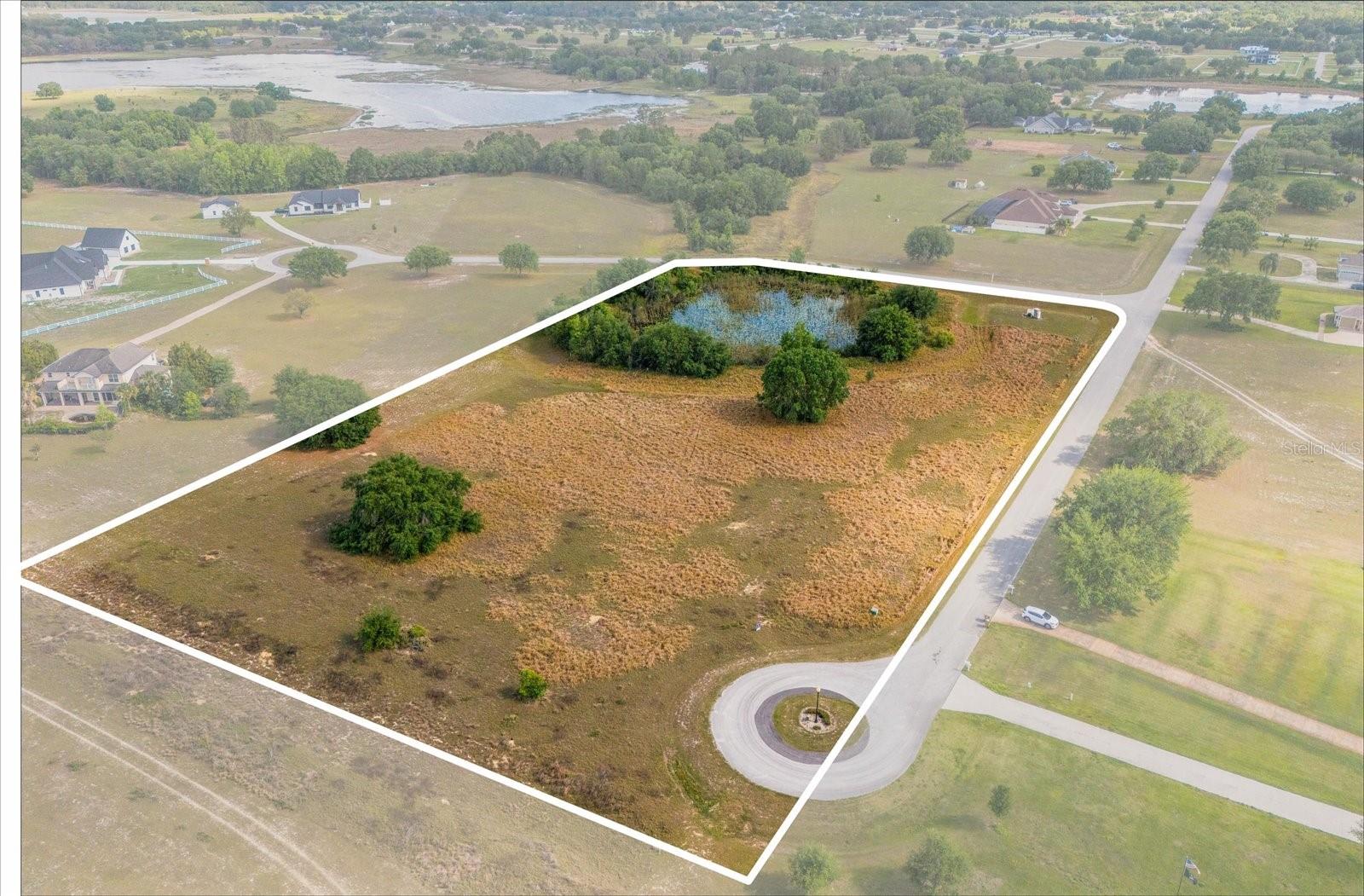 This equestrian-friendly, gated community offers the flexibility of no required build timeframe, allowing you to design your dream home at your own pace. Residents enjoy exclusive access to two private boat ramps—one
on Lake Morgan in the Riverview community and another in the Lakes community—providing direct entry to the Palatlakaha River, which connects to the picturesque chain of lakes, including Emma, Lucy, and Cherry Lake.
Nestled amid serene conservation views and a tranquil natural setting, this spacious lot requires a minimum 2,600sq. ft. home. Conveniently positioned near major roadways such as the Turnpike, Hwy 27, Villa City Rd,
and SR 19, this location offers seamless access to Clermont, Mascotte, and Groveland. Experience the perfect blend of privacy, natural beauty, and accessibility in this exceptional community!