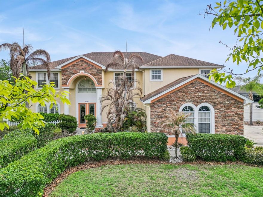 This expansive 5 bedroom home with an office, loft, and bonus room sits on over half an acre on Canoe Creek Road and offers a rare opportunity for both residential living and potential business use thanks to its OR1C light commercial zoning, which may allow certain professional or office uses subject to county approval. The home’s distinctive front elevation showcases columns, stone accents, and a charming pond that enhances the setting, while manicured hedges create a unique garden-style walkway that adds character and charm to the front of the property. Inside, formal living and formal dining rooms provide an elegant introduction to the home. The spacious floor plan also includes two bedrooms on the first floor along with a renovated full bath with hall access to the pool and a convenient half bath for guests. The family room is anchored by a fireplace and flows into the open kitchen with dinette, creating a comfortable space for everyday living and entertaining. French doors lead to the outdoor living area where a screened pool with waterfall feature added in 2022 provides an inviting setting for relaxing or hosting gatherings. Upstairs you will find the private primary suite along with additional bedrooms, an office, a loft, and a large game room offering excellent space for recreation, hobbies, or gatherings. The primary suite features an en suite bath with dual vanities, a jetted soaking tub, and a separate shower. Major improvements include a shingle roof replaced in 2018 and a water heater replaced in 2022. Completing the property is a side-entry three car garage and a generously sized lot while remaining conveniently located near shopping, dining, and major roadways.