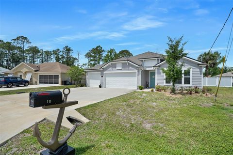 Photo of 10 Raleigh Drive, Palm Coast, FL 32164 (MLS # FC318095)