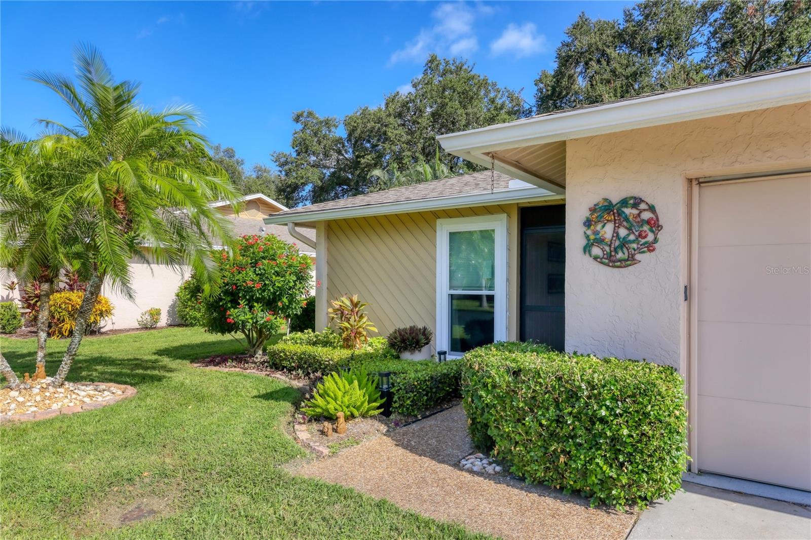 DELIVERING STYLE, COMFORT AND VALUE: CENTRAL SARASOTA’S BEST KEPT SECRET! Step into this beautifully appointed 2-bedroom, 2-bath attached villa and experience prime Sarasota living without the premium price. Bathed in natural light, the spacious interior showcases IMPACT WINDOWS, elegant QUARTZ COUNTERTOPS in the kitchen and bathrooms and sleek LAMINATE FLOORING. Newer appliances (refrigerator, range, washer, and dryer) and stylishly LED-illuminated mirrors add to the villa’s appeal. If you love outdoor living, you’ll appreciate and embrace the charming paver patio nestled in view of a mature lush landscape —ideal for enjoying your morning coffee or unwinding in the evening breeze. With its desirable location in south Sarasota, this villa is truly a gem you won't want to miss!