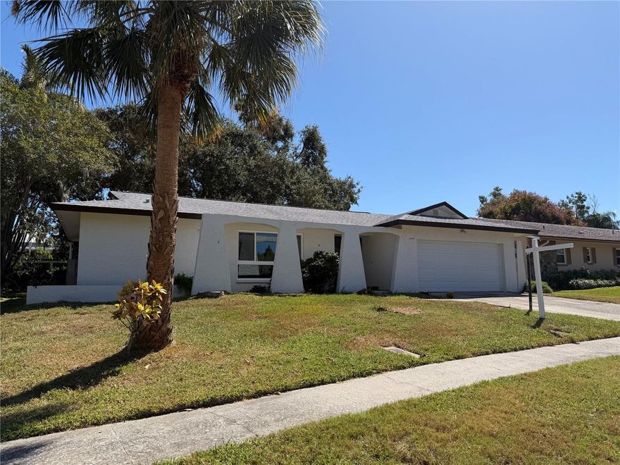 Welcome to this spacious 4-bedroom, 2-bath pool home brimming with potential, located in the highly sought-after Del Oro Groves neighborhood. Nestled on a charming tree-lined street, this well-established community is renowned for its beautiful homes, pride of ownership, and warm, friendly atmosphere. Step inside to discover a split-bedroom floor plan offering both privacy and comfort. The generous living spaces feature large sliding glass doors that seamlessly connect to the screened pool area, making this an ideal home for entertaining and indoor-outdoor living. Additional highlights include freshly painted exterior for great curb appeal, spacious bedrooms and living areas, Two-car garage with ample storage, and a backyard ready to be transformed into your own private oasis. Located just minutes from beautiful sugar sand beaches, you'll also enjoy very close proximity to Ruth Eckerd Hall, top rated dining options, boutique shopping, and Tampa Bay's nightlife galore. With its prime location and solid bones, this home is a fantastic opportunity to customize and make your own. Don’t miss the chance to live in one of the most desirable neighborhoods in the area!