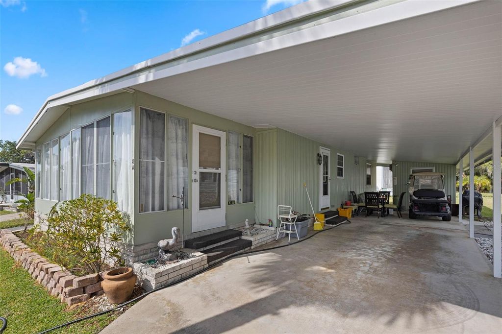 Photo of 8 Cocos Plumosa Drive #A, Eustis, FL 32726 (MLS # O6366279)