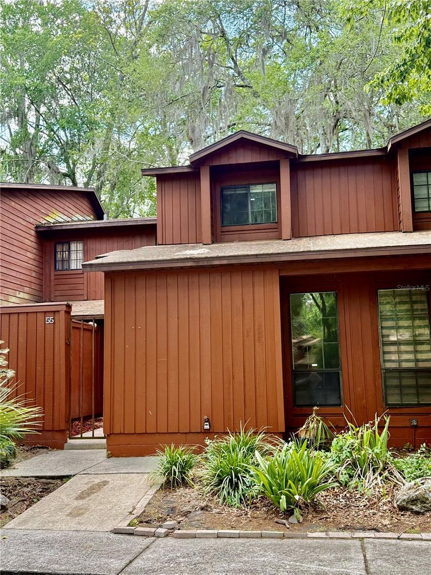 Great LOCATION in Gainesville FL!! Beautifully updated 3-bedroom, 3-bathroom townhome-style Rockwood Villas condo. This spacious home offers luxurious vinyl flooring with no carpet, updated bathroom vanities, fresh painting throughout and new energy-efficient AC, making it truly move-in ready. First floor features a large living room, dining area, open kitchen, one bedroom with full bathroom, and washer/dryer closet. Second floor has two generously sized bedrooms, each with their private full bathrooms and large closets. This unit features a gated front courtyard designed to create a private garden, and a screened-in back porch ideal for barbecuing and relaxation. Minutes away from the University of Florida, Santa Fe Community College, UF Shands and North Florida Regional Hospitals, Oaks Mall, Butler Plaza and Celebration Pointe, enjoy unbeatable access to working, shopping, dining, and entertainment. Rockwood Villas features a wealth of amenities, including community swimming pools, tennis courts, basketball courts, and volleyball court, perfect for homeowners and investors. The HOA dues cover essential services like roof maintenance, exterior building maintenance, and all community amenities. The bus stop is right outside the entrance with multiple RTS bus routes to the University of Florida (UF) campus and shopping center. Don't miss the opportunity to make this wonderful property your own.
