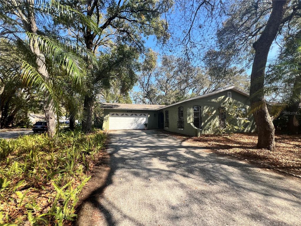 Photo of 9715 Hidden Oaks Circle, Tampa, FL 33612 (MLS # TB8469457)