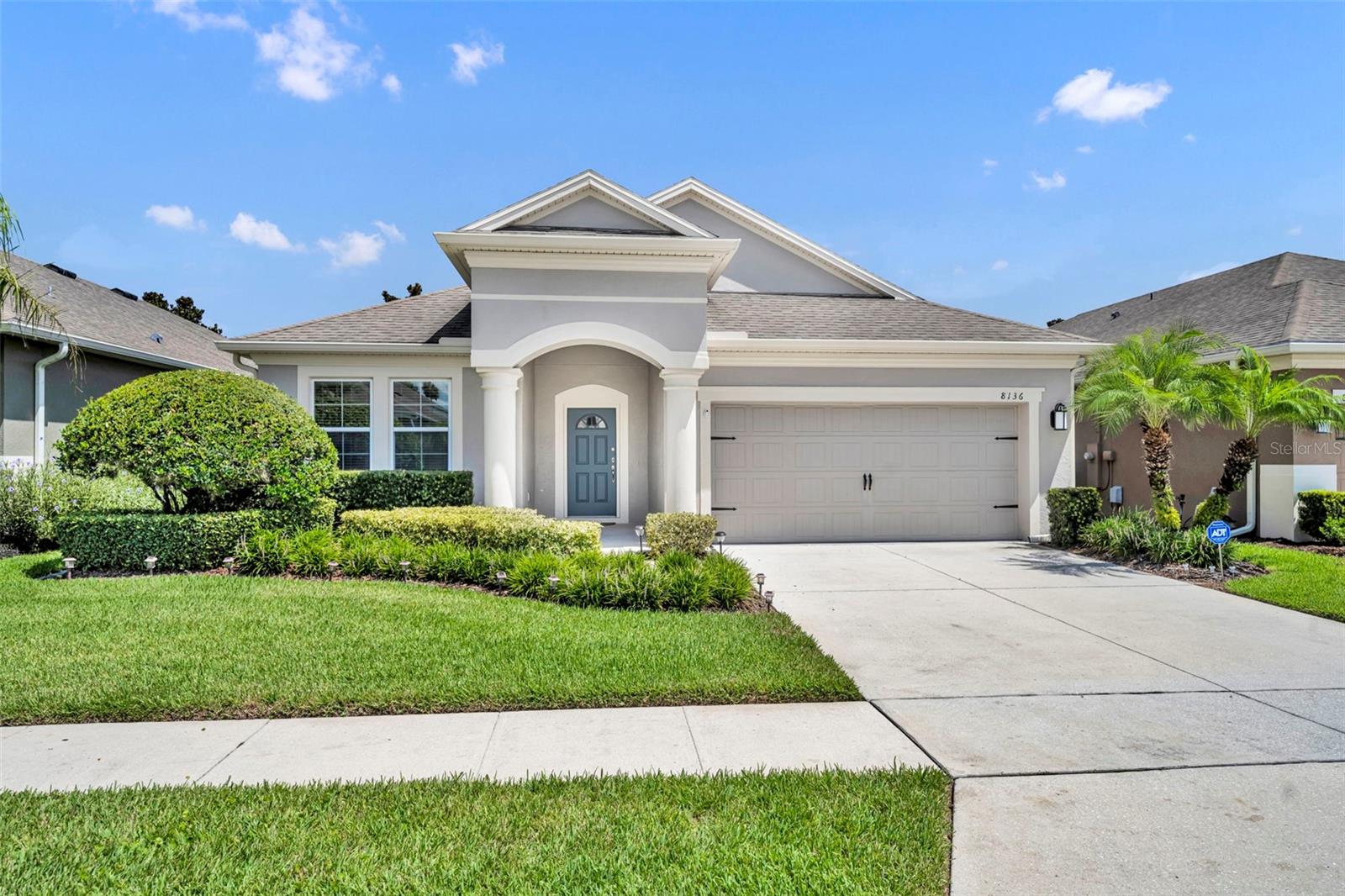 One or more photo(s) has been virtually staged. Welcome to Enclave at Aloma — a gated community quietly nestled in a convenient Winter Park location, offering easy access to everything you need. This meticulously maintained 4 bedroom, 2 bathroom home has only had one owner since it was built in 2013, and it shows! From the moment you arrive, you’ll notice the charming curb appeal, manicured landscaping, and inviting front porch with soaring ceilings. Step inside to a welcoming foyer and a thoughtfully designed 3-way split floor plan. Two spacious bedrooms with laminate flooring, ceiling fans, and built-in closets sit to the left, sharing a hall bath. Just across the hallway is a third guest bedroom with its own walk-in closet, ideal for guests, a home office, or a flex space. Straight ahead, the home opens into a bright and airy main living space. The kitchen features rich espresso cabinets, granite countertops, stainless steel appliances, a walk-in pantry, and a center island with pendant lighting — all overlooking the dining and living areas. Tucked privately in the back of the home, the primary suite offers a peaceful retreat with a spacious layout and en-suite bathroom featuring double vanities, a large walk-in shower with bench seating, and a generous walk-in closet. Off the dining room, sliding glass doors open to a massive screened-in lanai that spans the entire length of the house and overlooks a fully fenced backyard with lush grass. Additional highlights include a 2-car garage, an inside laundry room with built-in cabinetry and newer washer and dryer, and a location that offers the best of both privacy and convenience. Zoned for highly rated Seminole County schools and neighboring the prestigious Trinity Preparatory School campus — known for its #1 STEM program in the Orlando/Winter Park area — this home is also just minutes from 417, 436, shopping, dining, and more. This is a rare opportunity to own a well-cared-for home in a gated community, close to everything but tucked away from it all. Call today to schedule your private showing!