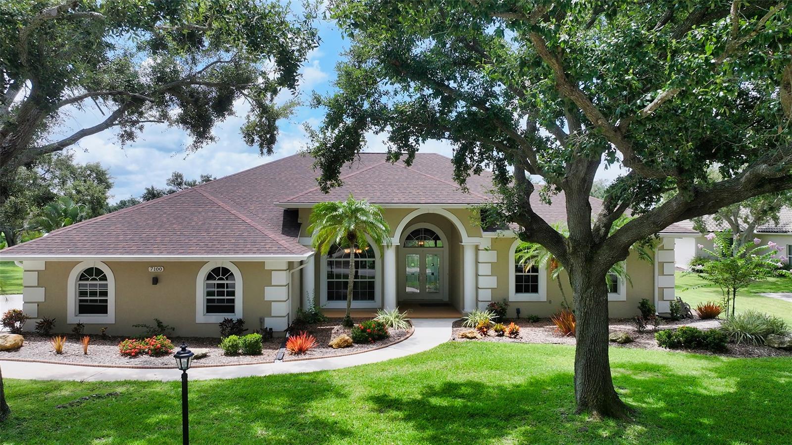 Here is the one you have been waiting for, fully updated & in move-in condition. This home sits on 6/10 of an acre with expansive lake & golf course views. Featuring over 3,000 sq. ft. under air of architectural elegance. This beautifully renovated home offers 4 full bedrooms, office & 3 full baths. Office could serve as 5th bedroom if needed. The entire home has wood look tile floors with no carpet in the home. Newly updated kitchen with white cabinets, granite counters, stainless appliances & under counter Kinetico water purifier for cooking. All bathrooms have been renovated to current decor with granite counters & custom tile in showers. Solar heated saltwater pool has a new picture frame screen to enhance the views & new pool pump. Roof was replaced 5 yrs. ago. 2 new A/C units 4 & 2 yrs old. All windows & doors are impact glass accept for front of the house & kitchen bay window. Re-built wood fireplace in family room. Whole house Kinetico water softener. 2 1/2 car side load garage offers additional space for storage. Golf course membership is optional. Community has tennis courts & also a bar restaurant. Very low association fee of $1250 per year. Every home has a private well for irrigation, all lots are 1/2 acre & up & all garages are side entry or courtyard giving the community a clean open feeling. Mature Oak tree canopy throughout the community with deer always seen roaming the neighborhood. If you want gorgeous views & room between homes this is the one for you. Location is amazing with easy acess ti I-75, restaurants & shopping all nearby.