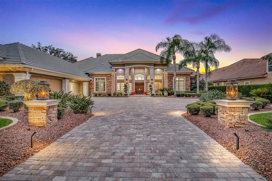 Alaqua Lakes - Water and golf front COMPLETELY RENOVATED Dave Brewer custom 1-level ranch in guard-gated Alaqua Lakes.  Sparkling pool, 4 bedrooms, 4 full and 2 half baths, theater room, office, workout room, sauna, and more - TURN KEY and NO EXPENSE SPARED.  Arrive at the grand courtyard fully brick paver driveway and enjoy natural gas lamps and low voltage landscape light abound which set the tone for a truly remarkable estate.  Solid wood double front door leads to a magnificent open floorplan, with soaring ceilings, an abundance of natural light, and sweeping water and golf vistas throughout.  The gourmet kitchen is worthy of Michelin-star meals with its Dacor range, double oven, built-in 48" refrigerator, 2 dishwashers, walk-in pantry, and more.  The master bedroom is a sanctuary unto itself with a truly spa-quality master bath, sauna, dual oversized walk-in closets, and a separate work-out room with its own half bath.  A separate home theater brings the silver screen home to you, while the expansive lanai with retractable screens and summer kitchen lets you enjoy the ultimate Florida lifestyle.  A whole-home generator(38kW) ensures no power interruptions in poor weather, and dual pane PELLA windows and doors throughout make for an energy-efficient and quiet home.  The oversized 4+ car garage is perfect storage for all life's necessities.  Too much to list; a MUST SEE today!!  Residents can enjoy the amenities of a unique 7-acre community park, including an open-air pavilion, a multi-purpose field, tennis courts, and much more.  All minutes from shopping, dining, business districts, and major highways.  This property may be under audio/visual surveillance.