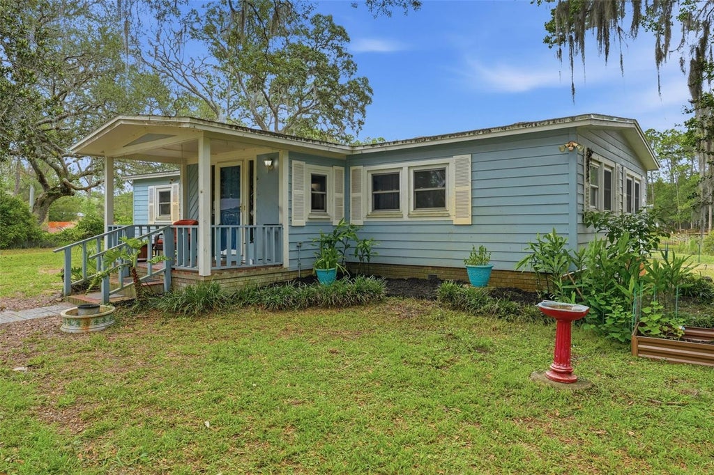 Photo of 9380 N Cedar Cove Road, Dunnellon, FL 34434 (MLS # OM726309)