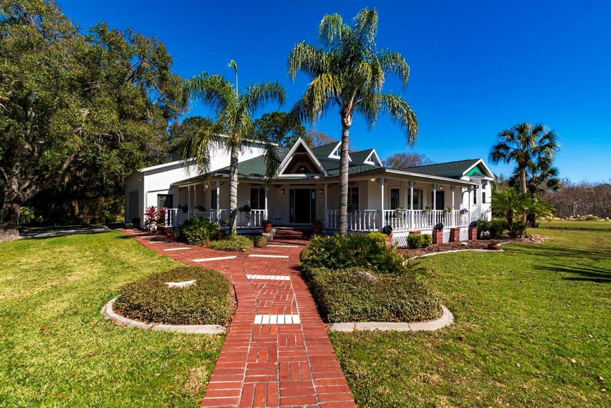 Welcome to a rare opportunity in the heart of Ridge Road frontage—6.19 acres of versatile land with a custom pool home, private fishing pond, and zoning that allows residential, agricultural, and C2 commercial uses. Whether you’re dreaming of a private retreat, a working farm, or a business hub, this property has the space and flexibility to make it happen.

The Home

4 bedrooms, 4 full baths, 2 half baths

Wraparound porch with swing for relaxing country evenings

Great room with real wood-burning stove for cozy winters

Formal dining room large enough for a farmhouse table and hutch

Monstrous gourmet kitchen with solid oak cabinets, granite countertops, and a patented center island with swivel stools

Master suite and 4th bedroom/office/den on the main floor

Two upstairs bedrooms with private baths; one includes an adjoining room ideal for a nursery, home office, or sitting area

Over 1,065 sq. ft. of covered, tiled lanai for entertaining

Huge 50’ x 30’ pool with slide for year-round fun

The Land & Extras

6 acres of Ridge Road frontage plus dual access (Ridge Road & Creston)

Private fishing pond and space for your own driving range

Barn for equipment, RV, or boat storage

Asphalt parking lot already in place with two entrances

Existing sheds for storage or workspace

Public water to the home; wells and septic for commercial/agricultural use

Wildlife all around—deer, birds, and open skies

Business Potential
With C2 zoning, you have up to 42 potential business uses—including storage units, plant nursery, roofing contractor headquarters, or event planning. The home itself is also a perfect setup for an Airbnb, wedding venue, or retreat center.

This is not just a property—it’s a lifestyle and a business opportunity wrapped into one. Space, seclusion, and unmatched flexibility make this estate truly one of a kind.

 Schedule a private showing today and explore how this property can fit your dreams. Also being sold as residential MLS# 7879848