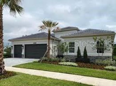 Photo of 32252 Mahogany Valley Drive, Wesley Chapel, FL 33543 (MLS # J995604)