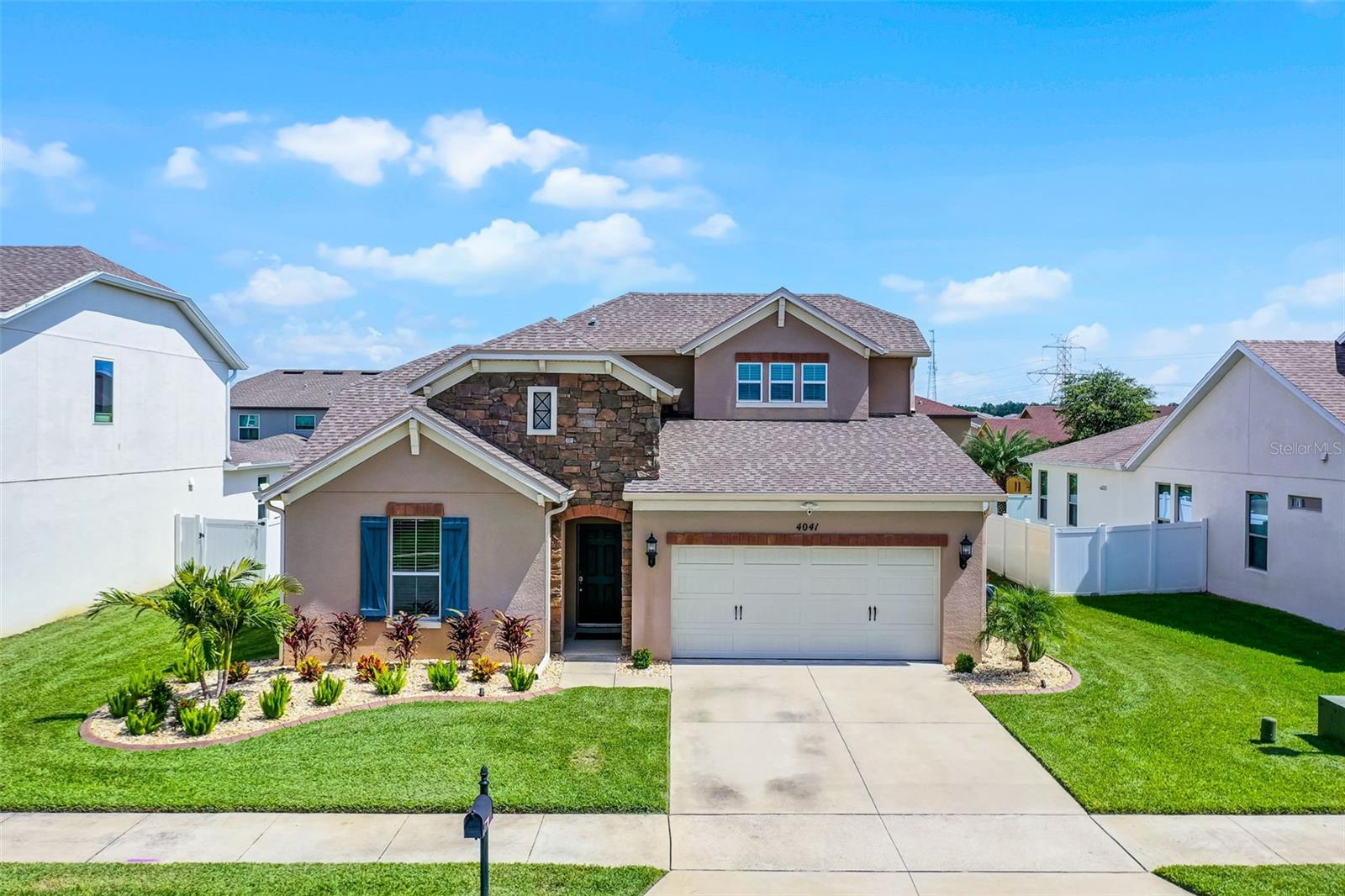 It’s rare to find a home that comes this close to perfect—but 4041 Silk Oak Lane might just be the one. The current owner spared no expense in thoughtfully renovating and upgrading nearly every inch of this stunning home, creating a residence that feels better than new in every way. And here’s the best part: a similar-sized new construction home in a nearby community would cost nearly $100,000 more—without any of the high-end upgrades already in place here. Located in a highly desirable Minneola neighborhood, this 4-BR, 3-BA home with over 2,600-SF of living space offers a versatile floorplan with the primary suite and two bedrooms downstairs, and a large bonus room or fourth bedroom with a full bath upstairs—perfect for guests or multigenerational living. There’s also a home office or den on the main floor, along with a spacious open-concept kitchen, dining, and living area that opens through pocketing sliders to a beautifully tiled and screened lanai. The upgrades are truly exceptional. Inside, you’ll find nearly $45,000 in COREtec Grande luxury vinyl plank flooring—the highest quality LVP on the market—durable, waterproof, pet-safe, and stunning throughout. The kitchen is a gourmet dream, featuring level 5 granite countertops, GE Profile double oven, a vented hood, under-cabinet LED lighting on both the upper and lower cabinets, and a sleek Samsung Bespoke refrigerator. The kitchen appliances are new, and the washer and dryer convey with the home. The primary suite has been refreshed with new tile in the shower, and the entire home interior has been repainted. All lighting, ceiling fans, and fixtures throughout the home have been upgraded to high-end designer selections, and the primary bathroom features beautiful LED luxury mirrors. New recessed LED lighting and elegant 6-inch wood baseboards have been installed throughout the home, and the upstairs bath includes a stylish vanity upgrade. Smart-home features include WiFi thermostats on both floors, a smart garage door motor with integrated camera, Ring doorbell, and exterior security cameras. Outside, over $10,000 was invested in landscaping and hardscaping, including concrete curbing, stonework, mature trees, and landscape lighting. The backyard is fenced with white vinyl privacy fencing, and features custom pavers and seamless gutters. The roof is just 7 years old, and the home includes a transferable termite bond for added peace of mind. Residents of the community enjoy two sparkling pool, along with close proximity to top-rated schools like Grassy Lake Elementary and Lake Minneola High. The neighborhood is ideally situated near the Minneola Sports Complex, the new Publix Shopping Center, and the scenic South Lake Trail, with easy access to Florida’s Turnpike and Highway 27—making commuting a breeze and putting Clermont, Winter Garden, and Orlando well within reach. Homes like this—beautifully upgraded, perfectly maintained, and priced far below the cost of comparable new construction—rarely last long. Don’t miss your chance to own one of Minneola's best. Schedule your private showing today.