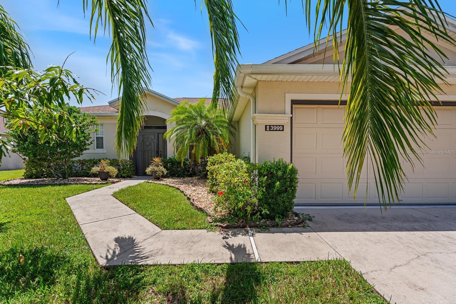 Perfect Rental for easy commute to Tampa or Orlando and to live in this Waterfront & Nature Lovers' Paradise! This inviting 3-bedroom, 2-bath waterfront home in the highly sought-after Carillon Lakes Community. This charming home, set on a beautifully landscaped lot, features lush greenery, well-maintained flower beds, and a welcoming screened in front porch. The backyard is a true gem, boasting wonderful fruit trees, including mango, avocado, and citrus, all overlooking serene water views with no back neighbors. The well-equipped kitchen with granite countertops, gas range is perfect for culinary enthusiast and waterfront view from kithen dining area. The open floor plan provides ample space for entertaining family and friends. The spacious primary suite includes a luxurious bathroom with a tiled shower, rain shower head, and dual sinks. Enjoy peaceful pond views from the oversized screened lanai, while savoring the privacy of no rear neighbors. Other features include a two-car garage, a large laundry room, and a split bedroom floor plan providing comfort and privacy. Carillon Lakes community offers a 24-hour guarded gate, a clubhouse with lots of holiday events, fitness center, pool, spa, and recreational facilities including sports courts and a playground. Your Rent includes cable and internet! Tenant will be responsible for maintaining the soft water system, weeds and trim trees to satisfy HOA. Photos were done before tenant moved in. Don't miss your opportunity to rent this exceptional piece of paradise. Schedule your viewing today!