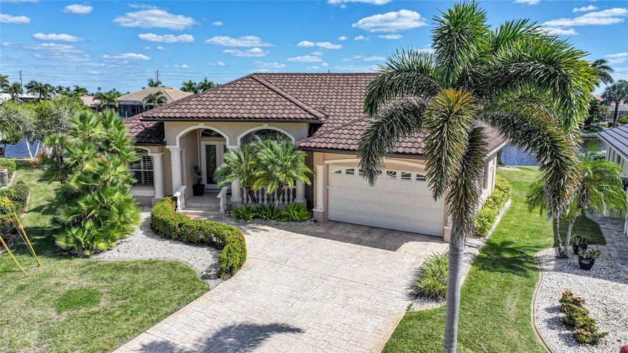 Welcome to 500 Andora Drive—a stunning waterfront retreat nestled in one of Punta Gorda’s most prestigious boating communities. Perfectly positioned on a key lot with 140 feet of seawall along a 100-foot-wide sailboat canal, this elegant 3-bedroom, 2-bath pool home captures the essence of Florida luxury living with serene eastern exposure and direct access to Charlotte Harbor and the Gulf of Mexico—no bridges, no limits.
From the moment you arrive, you’ll be captivated by the home’s curb appeal and meticulously maintained grounds. Inside, a bright and inviting open floor plan welcomes you with cathedral ceilings, walls of glass sliders, and soft natural light that perfectly complements the tranquil waterfront backdrop. The spacious living area flows effortlessly into the formal dining and kitchen spaces—ideal for both grand entertaining and relaxed everyday living.
The kitchen boasts generous counter space, ample storage, and beautiful views of the water and pool, making meal preparation a pleasure. The primary suite offers a private retreat with sliding doors opening to the lanai and pool area, a large walk-in closet, and a luxurious ensuite bath. Two additional guest bedrooms provide comfort and flexibility for visiting friends or family.
Step outside to your own private paradise. The screen-enclosed pool and lanai area offer the ultimate outdoor living experience—perfect for morning coffee as the sun rises over the water, or evening cocktails under the stars. The 45’ × 7’ composite dock, complete with electric and water hookups, provides ample space for your yacht or sailboat, with deep-water access just minutes from open harbor.
Designed for peace of mind, the home includes accordion hurricane shutters, and has been exceptionally cared for inside and out. Every detail reflects pride of ownership and timeless coastal style.
Located in a quiet, upscale enclave of Punta Gorda Isles, this residence is just minutes from Fishermen’s Village, downtown dining, boutique shopping, and the region’s most beautiful parks and marinas. Whether you’re seeking a full-time residence or seasonal getaway, 500 Andora Drive offers an unmatched blend of elegance, comfort, and waterfront luxury.
Experience the best of Punta Gorda living—where every sunrise paints your private waterfront with golden light.
