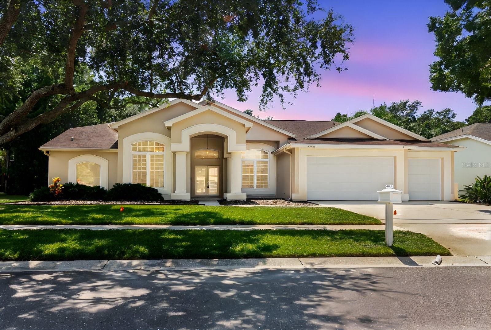 Welcome to your dream home in the highly sought after Lansbrook community, situated directly on Lake Tarpon! This spacious 5-bedroom, 3 bath residence features a 3-car garage and sits on nearly an acre of beautifully landscaped land, offering both space and serenity. One of the rare lakefront homes in Lansbrook, this property includes a private dock, perfect for evening sunsets, weekend boating, or peaceful moments by the water. Inside, you’ll find vaulted ceilings, an open and functional layout, and a cozy fireplace for relaxing evenings. The kitchen boasts stainless steel appliances, a double oven, and ample counter space, ideal for home chefs and entertaining alike. The master suite is a true retreat, featuring its own private entrance to the screened-in pool and spa and two spacious walk-in closets. The pool area is an entertainer’s dream, complete with a pool bath and multiple sliding glass doors leading directly from the living areas, seamlessly blending indoor and outdoor living. Located within the top rated East Lake school district, including access to the Engineering Academy at East Lake High, this home is perfect for families seeking excellence in education and community. Enjoy all the amenities Lansbrook offers: walking and jogging trails, soccer and volleyball fields, basketball courts, and more. This is Florida lakefront living at its finest, don’t miss your opportunity to own a rare piece of paradise in Lansbrook!