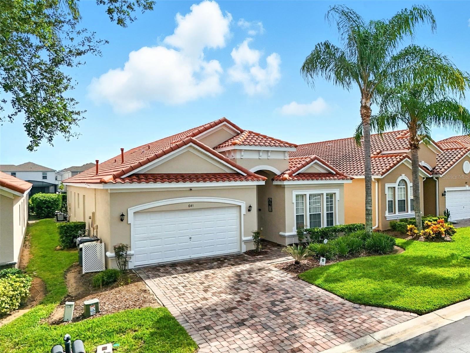 This stunning 5-bedroom home offers an exceptional blend of spaciousness, brightness, and tasteful furnishing, designed to provide comfort and style in every corner. Situated in a secure gated community, this residence boasts a south-facing sunny pool deck that invites endless relaxation and entertaining. With fresh paint inside and out, the home is in impeccable condition, ready for you to move in or rent out immediately. The gorgeous living room is a true centerpiece of the home, featuring ample space and natural light that streams in through large windows overlooking the sparkling pool. This welcoming area creates a perfect setting for family gatherings or quiet evenings. Adjacent to the living room is a formal dining room that offers an elegant space for special meals, complemented by a cozy breakfast nook and a countertop bar area ideal for casual dining or quick snacks. The large master suite is a private retreat, furnished with a king-size bed and direct access to the pool deck, allowing for morning swims or evening relaxation just steps away. The master bathroom is beautifully appointed with a large shower, a soaking tub, double sinks, and two spacious closets, providing ample storage and convenience. The second bedroom also features an ensuite bathroom and pool deck access, perfect for guests or family members seeking privacy and comfort. At the front of the house, a third bedroom suite with its own bathroom offers additional privacy. Two further bedrooms, each equipped with twin beds, share the fourth bathroom, making this home ideal for families or groups. The kitchen is designed for both functionality and style, featuring a new cooker and upgraded appliances that will delight any home chef. It seamlessly connects to the informal dining areas, enhancing the flow of the home. An indoor laundry room adds to the convenience, keeping everyday tasks out of sight. The garage has been thoughtfully transformed into a vibrant games room, complete with air hockey, a pool table, foosball, and a gaming station, providing endless entertainment for all ages. Step outside to the expansive pool deck, which offers plenty of space for sun loungers and outdoor activities. The sparkling pool includes a spa for relaxation, while a large, shaded lanai furnished with a table and chairs creates an inviting space for outdoor dining and socializing. Tuscan Hills is a prime location just 20 minutes from Disney and close to all major Central Florida attractions, this home offers unparalleled convenience. Nearby shops and restaurants add to the lifestyle appeal, while easy access to both east and west coast beaches make weekend getaways effortless. Orlando International Airport is just 30 minutes away, enhancing travel convenience. This home is perfectly suited as a spacious full-time residence or as a lucrative short-term rental, designed to accommodate social gatherings and comfortable living alike. With its excellent condition, stylish furnishings, and prime location, this property represents an outstanding opportunity to enjoy the best of Florida living.