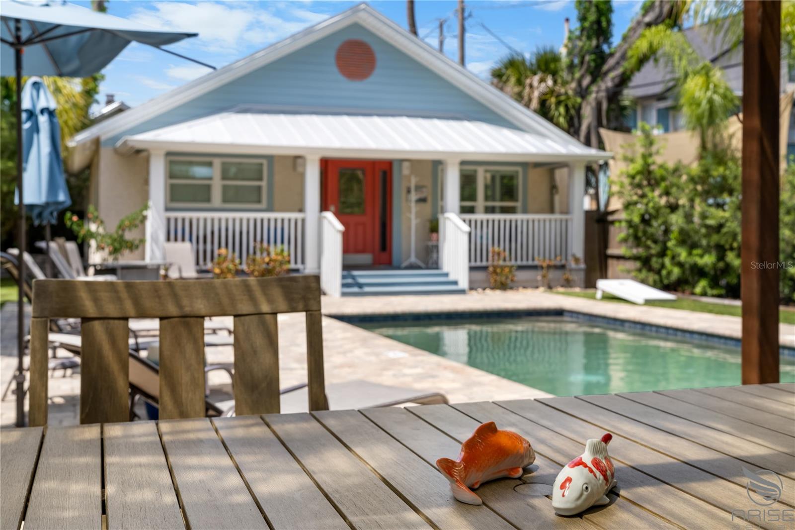 Welcome to “The Hideaway” – Your Private Slice of Paradise in New Smyrna Beach. Once an Airbnb Plus with over 65 glowing 5-star reviews, The Hideaway still delivers the same exceptional experience—now with an opportunity to make it your own! This fully remodeled retreat (transformed in 2019) offers a rare combination of serenity, style, and income potential. Step into your own private resort-style backyard, where you'll find a heated saltwater pool, outdoor soaking tub, rain shower, and a cozy gas fire table—perfect for starry nights. Grill up a BBQ lunch, kick back in the hammock, and unwind in complete privacy. Inside, the home is just as inviting. The designer kitchen is spacious and ideal for entertaining, centered around a show-stopping spiral staircase that leads to a fun loft bedroom—perfect for kids or guests. Two stylish bedrooms, a comfortable living area, and a generous laundry/utility room round out the space, offering both function and flair. Currently operated as a dedicated vacation rental, The Hideaway is ready to be your personal getaway, an investment property, or a mix of both. The location is unbeatable—nestled on The Loop, a scenic and popular biking/walking trail that connects both causeways and flows through New Smyrna’s vibrant Beachside. You’re just minutes from Canal Street and Flagler Avenue, where local shops, restaurants, Saturday farmers markets, monthly classic car shows, and the scenic Intracoastal Waterway await. And of course, the beach is just a 5-minute drive—or an easy bike or golf cart ride away. Whether you're looking for a peaceful escape, a savvy investment, or both—The Hideaway is the rare find that checks every box.