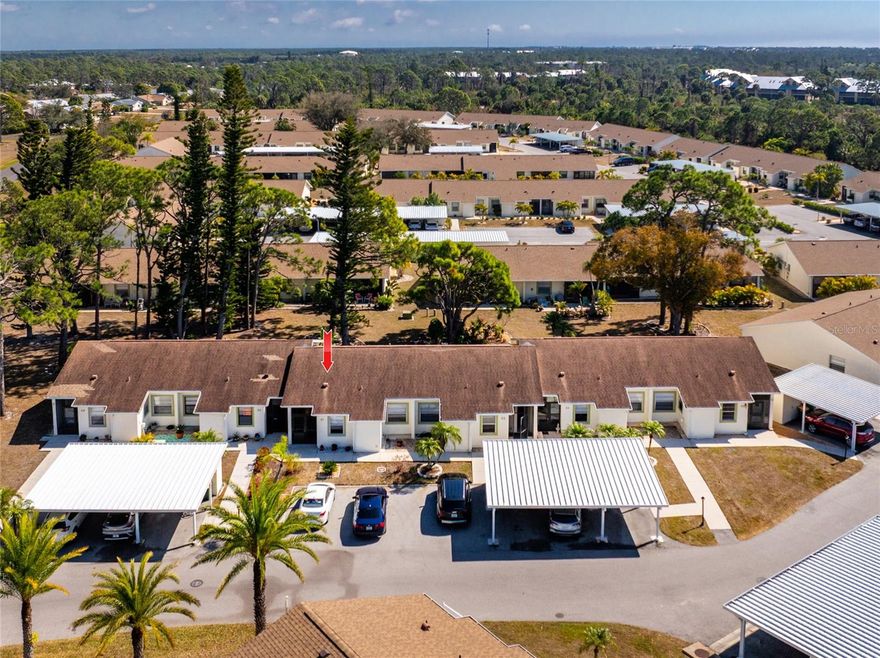 FOLKS - PRICES ARE NOW BACK TO 2019 LEVELS!  Don't wait any longer or you'll miss the chance for a great deal! This 2 bedroom/2 bath condo with a CARPORT is being sold FULLY FURNISHED TURNKEY! Just bring your suitcase and toothbrush!  Very open floor plan features a cathedral ceiling in the living room, with pocketing sliding glass doors opening onto the Florida Room.  The Florida room is air conditioned and glass enclosed, making this area usable year-round and adding additional square footage  in living area. The dining area has laminate flooring and is handily located just steps away from the galley Kitchen. The kitchen is light and bright, with white cabinetry, a new ceiling treatment and ceiling fan, and full appliance package including: BRAND NEW Frigidaire refrigerator, Whirlpool range, Whirlpool dishwasher, and microwave. Primary bedroom is  spacious enough to accommodate a king size bed and has a door directly to the Florida Room. There's a ceiling fan, laminate flooring and a wall closet. The Primary bath has been updated with an extended vanity and solid surface countertop, new faucet,  new lighting, step in shower w/door, and tiled flooring. The Guest Bedroom will be comfortable for your guests, with it's ceiling fan and good sized wall closet. The adjacent Guest Bath has an updated vanity and solid surface countertop, updated medicine cabinet and toilet, and combo tub/shower. The laundry room is just off the kitchen and has a full size LG WASHER AND DRYER (just 2 years old), laminate flooring and upper cabinetry for extra storage. Roof was replaced in 2022, carport in 2023,water heater in 2021 and AC in 2013.
(still going strong!) This condo is not in a designated flood zone either! The Village of Wildflower is a 55+ community consisting of 111 units, with a HEATED POOL and easy access to numerous county and state parks. Beaches, shopping, restaurants, Farmer's market, golfing and fishing - we have it all!  Call today for your appointment to see this WELL PRICED CONDO!