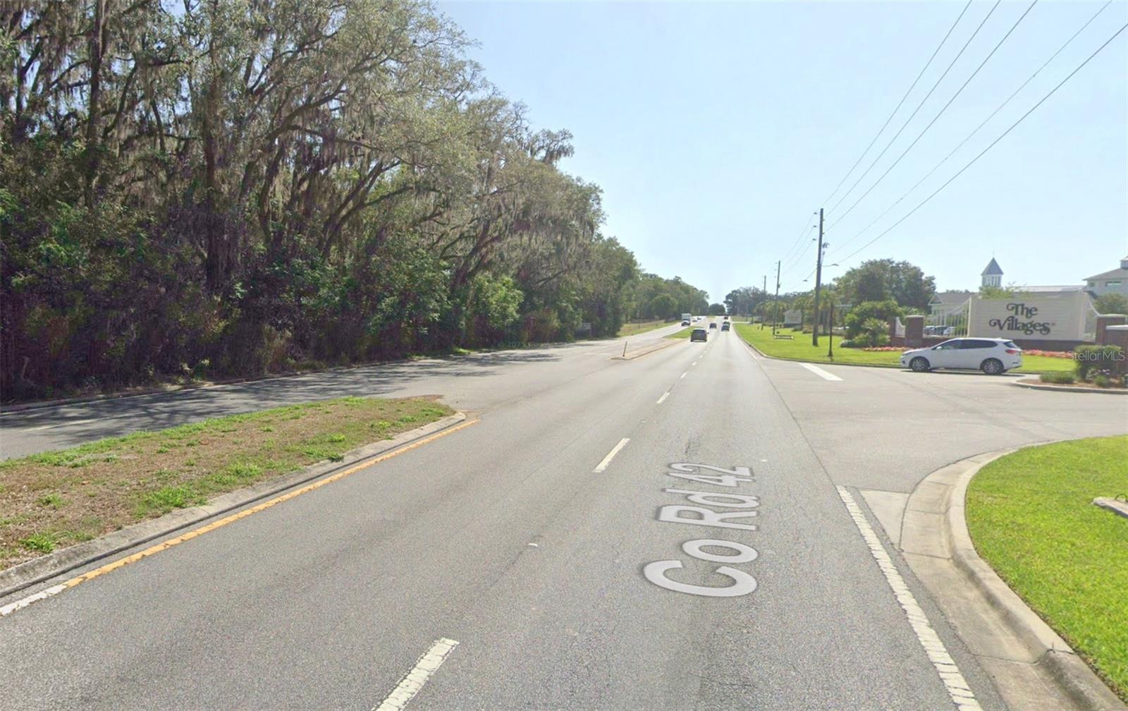 Great investment property in the path of development. Just under 10 acres, across the street from the Villages, property backs up to a new multifamily development.