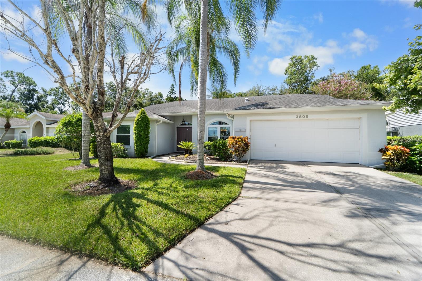 Feel the warmth and inviting atmosphere when you enter this wonderful 4 bedroom, 2 bath home with almost 2,200 SQUARE FEET in highly sought after Garden Lakes Estates. Wonderfully situated across from the neighborhood pool and clubhouse, this home greets its visitors with warm colors, cathedral ceilings and natural views. The remodeled kitchen is the center of the home. The blonde modern cabinetry and granite open to the family room making entertaining a breeze. Enjoy the Florida lifestyle as guest easily flow from the kitchen area to the 25x12 covered, screened lanai. The primary suite is split from the rest of the house and is adjacent to the formal living area and formal dining room. The primary bedroom provides a retreat from the rest of the world yet gives you direct access to the covered lanai. The remodeled en-suite bath provides dual vanities, walk-in shower, garden tub, private water closet and 2 walk ins. Move in with the peace of mind knowing that every major item has been addressed: ROOF 2019, HVAC 2021, IMPACT WINDOWS 2023. Garden Lakes Estates is conveniently located between downtown Sarasota and Bradenton. There is easy access to UTC mall, Anna Maria Island, Siesta Key, as well as all regional airports and hospitals.