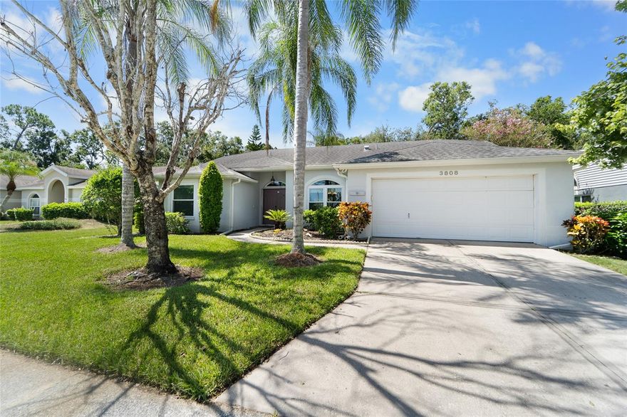 ASSUMABLE MORTGAGE under 3%.  Feel the warmth and inviting atmosphere when you enter this wonderful 4 bedroom, 2 bath home with almost 2,200 SQUARE FEET in highly sought after Garden Lakes Estates. Wonderfully situated across from the neighborhood pool and clubhouse, this home greets its visitors with warm colors, cathedral ceilings and natural views. The remodeled kitchen is the center of the home. The blonde modern cabinetry and granite open to the family room making entertaining a breeze. Enjoy the Florida lifestyle as guest easily flow from the kitchen area to the 25x12 covered, screened lanai. The primary suite is split from the rest of the house and is adjacent to the formal living area and formal dining room. The primary bedroom provides a retreat from the rest of the world yet gives you direct access to the covered lanai. The remodeled en-suite bath provides dual vanities, walk-in shower, garden tub, private water closet and 2 walk ins. Move in with the peace of mind knowing that every major item has been addressed: ROOF 2019, HVAC 2021, IMPACT WINDOWS 2023. Garden Lakes Estates is conveniently located between downtown Sarasota and Bradenton. There is easy access to UTC mall, Anna Maria Island, Siesta Key, as well as all regional airports and hospitals.
