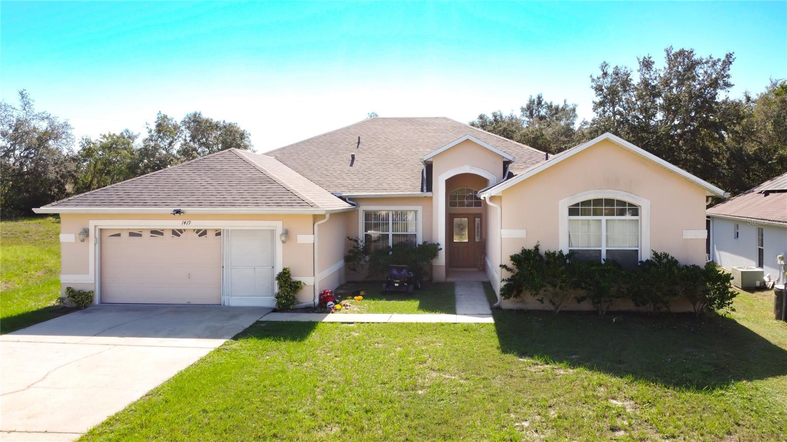 Beautiful 4Bed/3Bath home with BRAND NEW ROOF 10/2025!!! The home features a spacious layout. Entering through the front door you are welcomed by high ceilings that enhance the spacious feel throughout, making this 2300+ sq ft home a very specious retreat and a great space for a large or growing family. The fourth ensuite bedroom is tuck away on the opposite side of the home, making it prefect for a mother-in-law suite.
Take advantage of the amazing HOA amenities including multiple parks, playgrounds, and a pool. your monthly HOA fee includes Cable TV and Internet. Just 10 minutes from Poinciana Lakes Plaza where you'll find a variety of shopping & dining options as well as a Gym, Banks, Doctors offices, Dentist offices and Hospital. Close to Highways, Supercenter, supermarkets including Aldi's Publix and Sprouts Specialty Organic Grocery Store.  Call today for a private showing with a 24 hours notice.
All measurements are approximate and should be varified by the buyer prior to purchase.