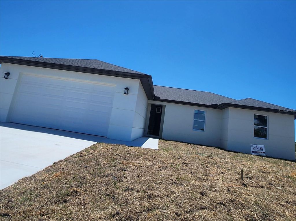 Photo of 12025 Clarendon Avenue, Port Charlotte, FL 33981 (MLS # TB8511833)