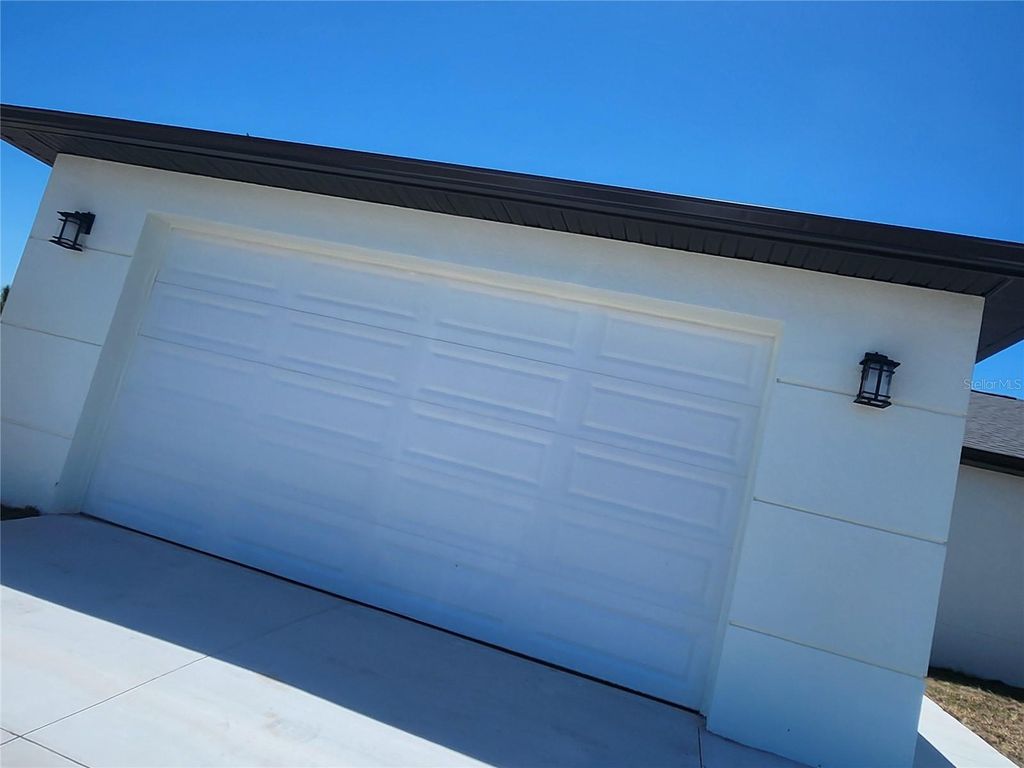 Photo of 12025 Clarendon Avenue, Port Charlotte, FL 33981 (MLS # TB8511833)