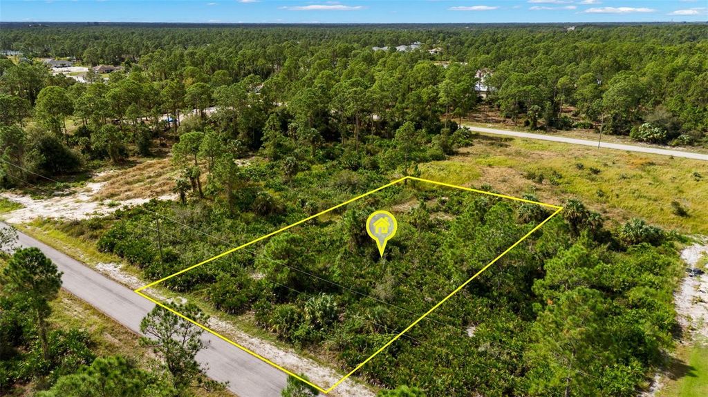 Photo of 1217 Magnolia Avenue, Lehigh Acres, FL 33972 (MLS # TB8320592)