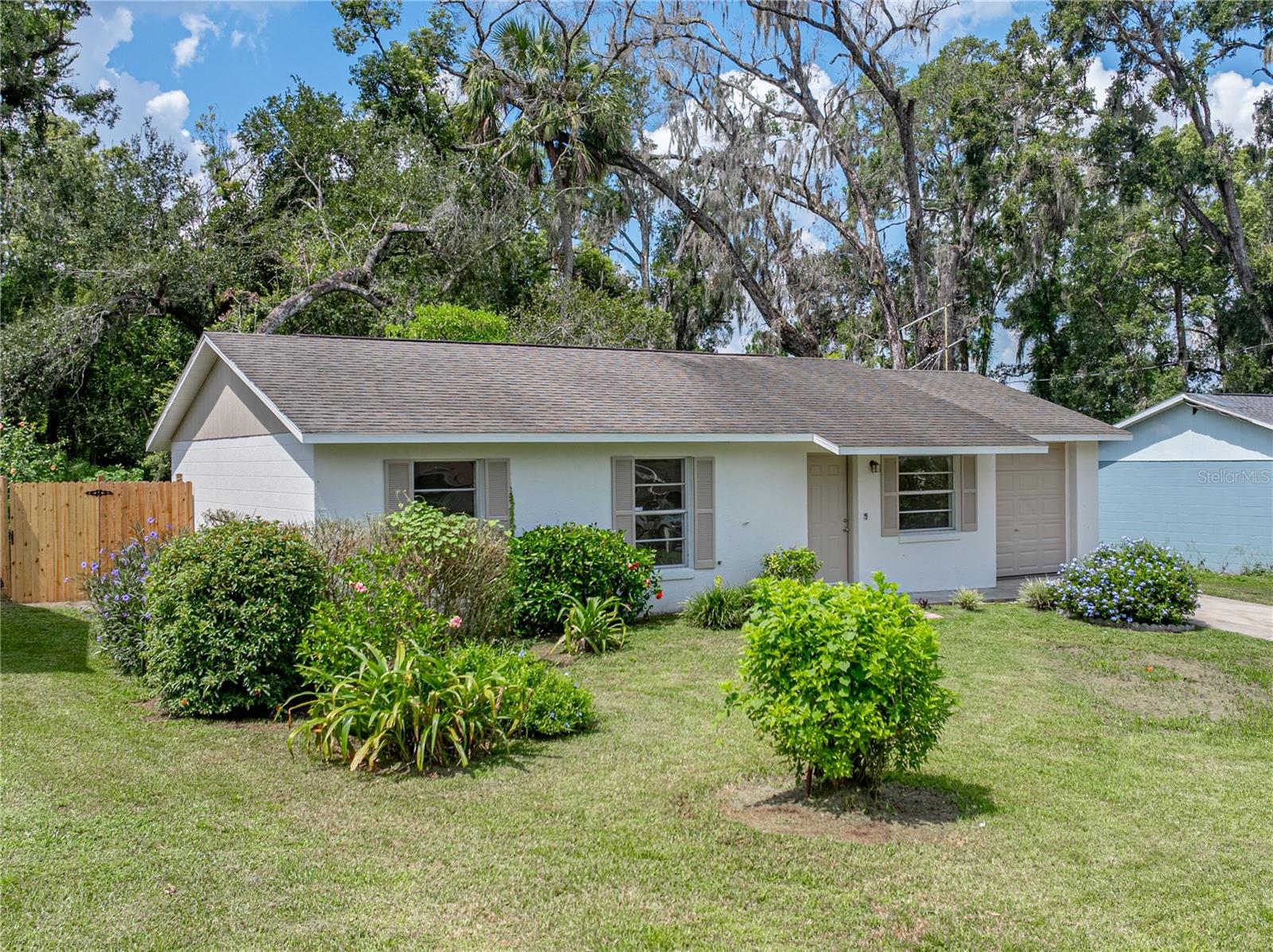 Welcome to this beautifully remodeled 3-bedroom, 1-bathroom home with a 1-car garage, perfectly situated just minutes from the heart of downtown Dade City! Enjoy small-town charm while being only 10 minutes from I-75 for an easy commute to Wesley Chapel, Tampa, and beyond. This move-in ready home features a new A/C, newer roof, and a fresh renovated interior with modern updates throughout. The open floor plan showcases new luxury vinyl plank flooring, fresh interior paint, and a gorgeous updated kitchen complete with granite countertops, stainless steel appliances, and white cabinetry. The spacious yard offers plenty of room for outdoor enjoyment, gardening, or entertaining. Whether you're a first-time homebuyer or looking to downsize, this home offers comfort, style, and convenience all in one! Don't miss your opportunity to own this turnkey home close to shops, restaurants, and all the charm Dade City has to offer!