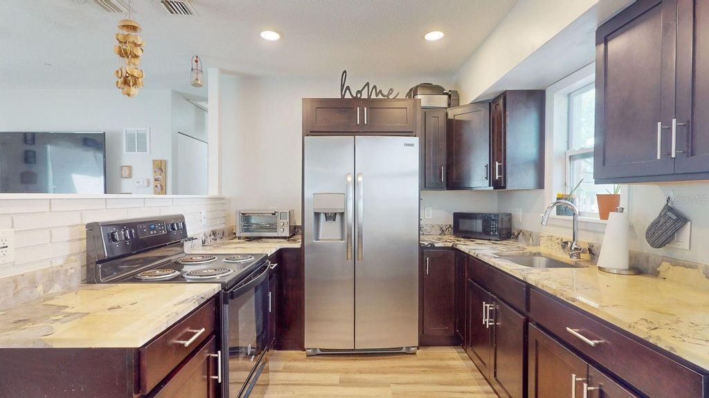 Photo of 827 26th Avenue S, St Petersburg, FL 33705 (MLS # TB8436557)