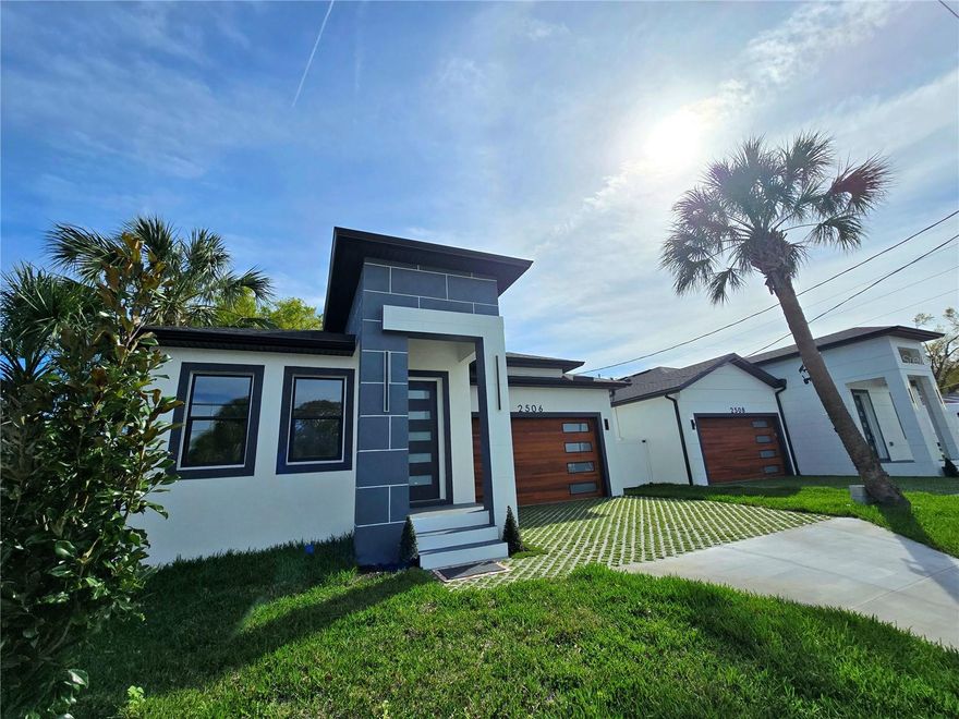 An Exceptional Modern home waiting for its new owner. NO HOA FEE & NO FLOOD insurance required! Unique Features and high-end impressive finishes on this one. YES, this home offers a full 2 CAR GARAGE for private off-street parking. Enjoy the Florida Lifestyle!  Kick back and relax in your private fenced backyard while you barbecue on the patio with friends. Bike or kayak from Tampa Riverwalk or to take the dog for a scenic walk along the river. Hungry? The community is part of the North Hyde Park neighborhood, which is a short drive along Tampa's Bayshore Boulevard to the trendy Hyde Park Village to sit and have a bite on an outside patio. Catch a movie in your living room watching a big screen tv in its built-in feature wall or gather for a late-night snack at the oversized island in your contemporary kitchen with stone waterfall counters and modern finishes. Plenty of space in the kitchen with the additional corner pantry with shelving for practical storage. The primary suite has a private and spacious bathroom with dual sinks & stone counters, modern style mirrors and sleek oversized, tiled shower. Additionally, Extra bonus of the walk-in closet with upgraded closet organizers. Located near the Westshore area where you’ll discover many newly constructed apartments, townhomes & stately homes sprinkled here and there. A short drive to Tampa Armature works or Oxford Exchange. Easy commute to Tampa International Airport, The Tampa Cruise Port, Amalie Arena, restaurants and shops at Westshore Plaza, International Mall, Picnic Island, Tampa's Bayshore Boulevard, Historical Hyde Park as wells as Tampa University and MacDill Airforce Base.