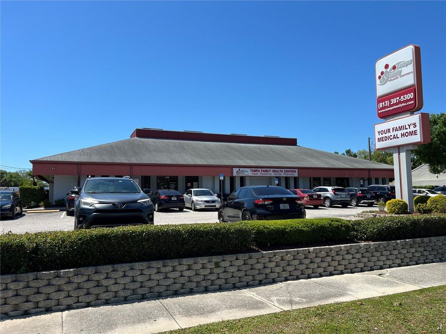 This South Tampa medical office is a rare find and is situated on a 30,000 SF CG zoned lot in the thriving South West Shore market. The site was originally designed as a bank site with external drive through and was purchased and redeveloped by Tampa Family Health Centers. The original external drive through (1,008 SF) was converted to a freestanding pharmacy while the main building (6,470 SF) functions as a multiple special medical facility which can be easily divided into 3 spaces. The left side (currently TFHC Women’s Care) has a 5 to 6 person private waiting room, 7 exam rooms, private physician's office, electrical and storage room, 3 station nursing/staff island, and 2 management and administrator offices. The middle space (TFHC Clinic) interconnects with the left side and has a 26 person waiting room, 2 ADA lobby restrooms, triage room next to reception desk, 4 station staff reception desk with adjacent managerial office and adjacent check out window office, internal billing office, supply closet, lab, lab restroom, 3 additional exam rooms, large 8 person break room with cabinetry and vending, and locker room area. The right side (TFHC Dental) also connects within the main buildings, yet has a private entryway and reception desk with 6 seat waiting area and adjacent triage or admin office, 2 station reception office, private practitioner office, 4 dental exam bays, central lab, standing x-ray room, pump equipment, and electrical room. This is a truly unique opportunity for a multi-practice medical facility, concierge practice, or investor who could subdivide the space to 4 units.

Located south of I-275 and north of the Selmon offering easy access to surrounding areas.