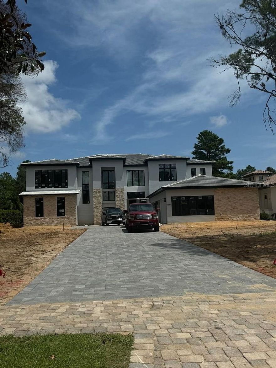 This elegant home in Monteverde features an impressive living room with 24-foot ceilings and a spacious covered outdoor area, perfect for relaxing by the resort-style pool.

The primary suite on the first floor offers comfort and privacy, while the junior suite on the second floor boasts a charming balcony. The loft is ideal for entertaining, and the gourmet kitchen showcases requinted quartz countertops, making it a perfect space for cooking and hosting.