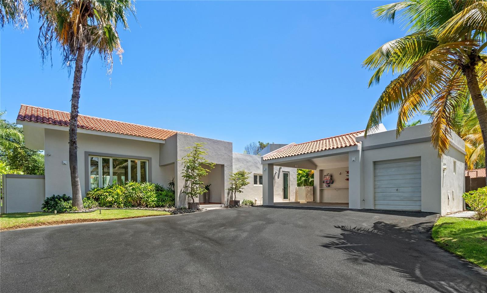 Welcome to this bright and spacious one-story residence, offering approximately 3,100 square feet of luxurious living on a generous 1,175 square meter lot. Designed for both comfort and entertaining, the open-concept kitchen provides ample space for hosting unforgettable gatherings. This exceptional property features three bedrooms, each with its own en-suite bathroom and walk-in closet.
Conveniently located near the South Gate of Dorado Beach East, the home boasts elegant, high-quality windows and doors throughout. The primary suite offers high ceilings and french doors that open to the outdoor spaces. Situated on an elevated lot with excellent drainage, the property ensures a secure and peaceful environment. It also includes a sparkling pool, a covered terrace, and an outdoor BBQ area—perfect for alfresco dining and relaxation.
Don’t miss the opportunity to own this piece of paradise. Contact us today to schedule a private tour!
Featured Amenities
BBQ Area
Covered Terrace
Exterior Lighting
Furnished
Laundry Appliances
Pool & Jacuzzi
Power Generator
Solar Water Heater
Stainless Steel Appliances
Water Cistern
AC Unit Available in Golf Cart Garage
Electric Water Heater
Wine Fridge
220 Plug Available for Charging Electric Car