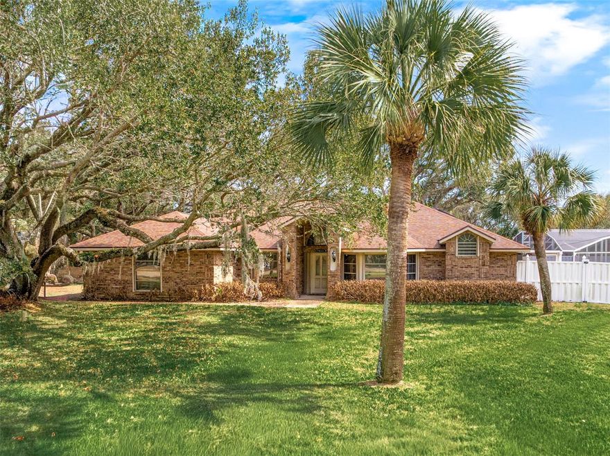 Awesome 3BR/2BA screened pool home on a large corner lot in the heart of the beautiful coastal town of Ponce Inlet, just approximately two blocks from pristine “no drive” beach access. This well-maintained home features a sturdy brick exterior, storm shutters throughout, a new roof in 2022, new HVAC system in 2023, new electric panel, a new energy-efficient solar-powered hot water heater in 2023, and a termite bond for added comfort and peace of mind. The manicured lawn and majestic live oak tree create a picturesque exterior, while both the rear and side yards are fully fenced. Enjoy the sparkling screened pool and expansive covered patio facing south for maximum sunlight all day. Enter through the welcoming foyer with a transom window that fills the home with natural light, leading into a spacious split-bedroom open floor plan with vaulted ceilings. The large living room features a charming bay window for added space and sliding doors that open to the east-side patio. The fully equipped eat-in kitchen opens to the living area and includes stainless steel appliances, granite countertops, ample cabinet and counter space, a breakfast bar, and a pantry, along with a separate dining area ideal for entertaining family and friends. The sizable primary suite offers a vaulted ceiling, two walk-in closets, and a large bathroom with a stall shower and soaking tub with a built-in seat. The second bedroom is spacious with a vaulted ceiling and a charming square bay window, while the third bedroom, located off the living room, features French doors with privacy window treatments and sliding doors leading to the south-side pool and patio area. A full guest bathroom is conveniently located between the guest bedrooms. Additional highlights include an inside laundry room and a large two-car garage. Wake up to the rhythm of the ocean and embrace the laid-back luxury of coastal living in this exceptional beachside home, ideally located within walking distance to waterfront restaurants, the historic Ponce Inlet Lighthouse and Jetty Park, Marine Science Center, museums, parks, dog park and beach, community center, pickleball courts, charter fishing, boating, and a wide variety of water sports.