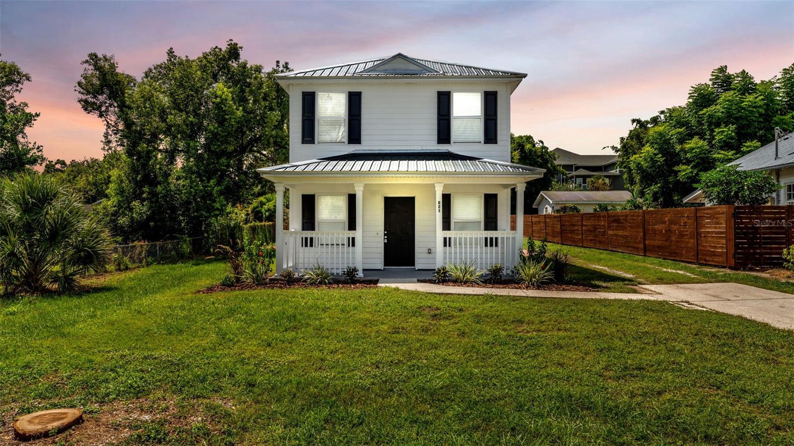 One or more photo(s) has been virtually staged. Welcome to 621 Hartsell Avenue in Lakeland, Florida! This stunning remodeled three-bedroom, two-bathroom home offers modern upgrades and classic charm in the heart of Lakeland. Inside, you’ll find a bright and open layout featuring new luxury vinyl plank flooring throughout, a fully updated kitchen with stainless steel appliances, and solid surface countertops. The freshly painted interior and fully renovated bathrooms are complemented by updated lighting, giving the home a crisp, modern feel. Outside the brand-new metal roof adds peace of mind for years to come. Situated on an oversized lot with fresh landscaping and a welcoming front porch this home is perfect for entertaining family and friends. Just steps away from Lake Hunter, there is easy access to nature and recreation while still being minutes from downtown Lakeland—enjoy the local dining, boutique shopping, entertainment venues, and community events that make this area so special. Don’t miss your opportunity to own a beautifully updated home in one of Lakeland’s most convenient and desirable locations!