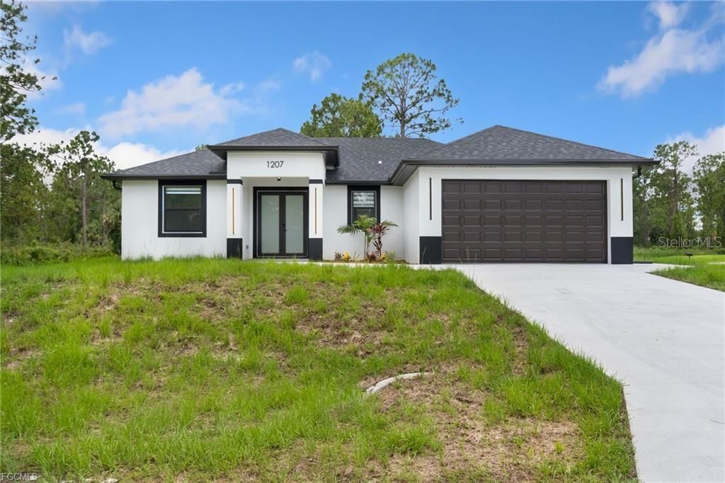 Photo of 1207 W 9th Street, Lehigh Acres, FL 33972 (MLS # A4666465)