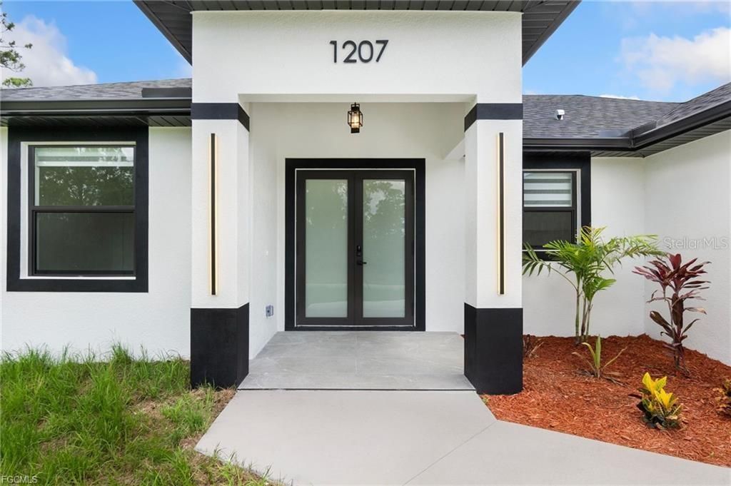 Photo of 1207 W 9th Street, Lehigh Acres, FL 33972 (MLS # A4666465)