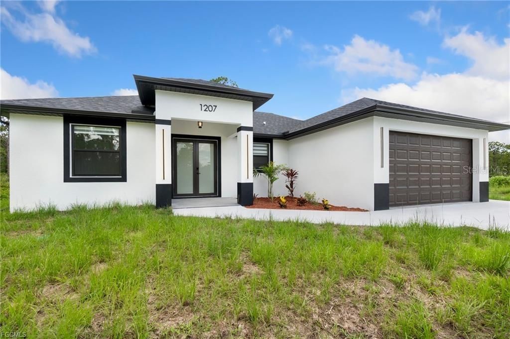 Photo of 1207 W 9th Street, Lehigh Acres, FL 33972 (MLS # A4666465)