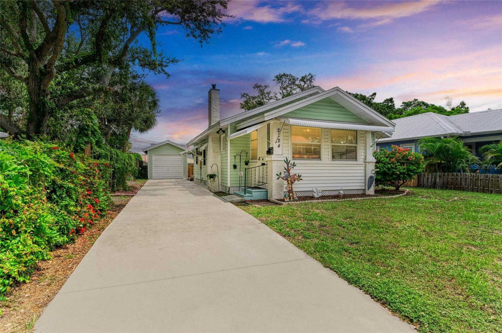 Charming cottage with spacious fenced backyard! This 100 year old home is a 2 bed 1 bath located in the heart of Wares Creek historical neighborhood. Nestled on a quiet tree lined street just minutes from downtown and the Manatee River. Featuring some original hardwood floors, an updated bathroom with a tile walk-in shower. This cozy layout is perfect for first-time buyers, down-sizers, or seasonal snowbirds. Enjoy Florida evenings in the front sun-room or the large fenced backyard - perfect for pets, gardening or even a future pool! The detached 1-car garage offers extra storage or potential for a creative studio/workshop. Perfect mix of location, charm, and opportunity! NO HOA - NO CDD -NO DEED RESTRICTIONS - Call today for your private tour.