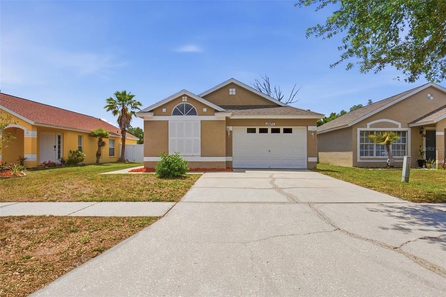 Welcome to this inviting single-story home tucked into the established Carrollwood Creek community. Offering a functional layout, the residence features four bedrooms and two full bathrooms, providing flexibility for a variety of living arrangements. The main living area flows comfortably into the kitchen and dining space, creating a natural setting for both everyday living and entertaining. Large windows bring in natural light, enhancing the home’s warm and welcoming feel.
The split-bedroom design allows for added privacy, while the overall layout maximizes usable space throughout. A one-car garage and manageable yard size make for easy day-to-day living with minimal upkeep. Conveniently located near shopping, dining, and major roadways, this home offers both comfort and accessibility in a well-established Tampa neighborhood.