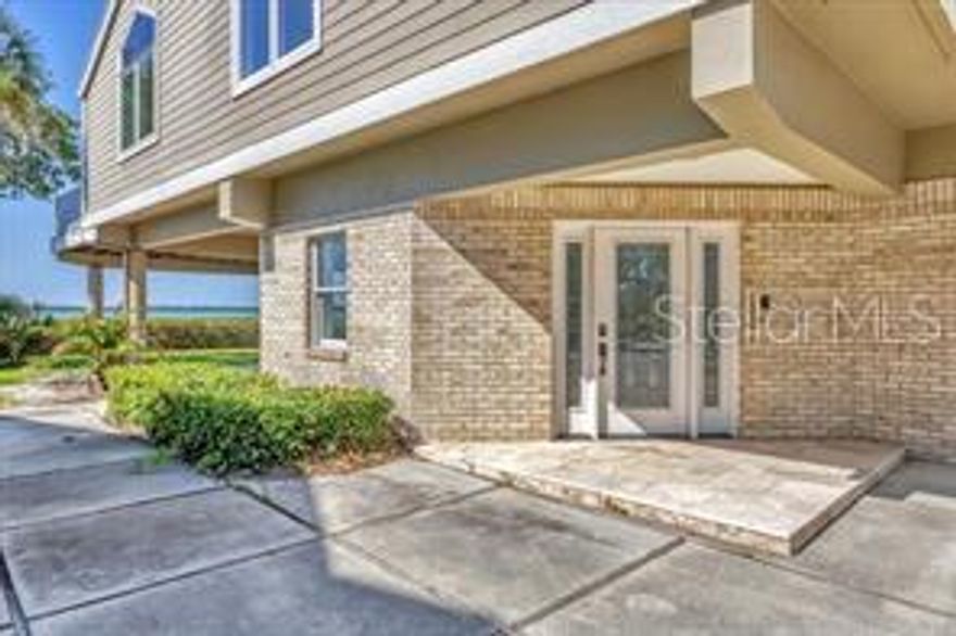 79 Tidy Island Blvd is located the west end of the island. Breath taking bay views of Longboat Key, Intracoastal waterway and downtown Sarasota. The entry has a foyer with storage room, 2 car garage with glossy epoxy flooring and elevator servicing main living level. Additionally, covered ground level private patio with marble flooring makes the perfect entertainment space and opportunity for outdoor kitchen with gas, water and electric connections. Open floor plan living area accented by high ceilings with  skylights, bamboo flooring and walls of bayfront windows allowing for a beautiful view of the sparkling water. Spacious bayfront living room with gas fireplace adjoins the dining area with built ins and wet bar. Family room off the kitchen opens to sunroom with vaulted ceiling and floor to ceiling windows and sliders with uninterrupted bay views.  Perfect deck  for outdoor living featuring water, gas and electric connections.  Kitchen offers large island, wine refrigerator, stone countertops, solid wood cabinetry,  6-burner gas range, convection oven, warming drawer, dual dishwasher drawers and LG refrigerator.  Master suite has built in shelving and windows with plantation shutters. Beautifully renovated master bath features Quartz countertops, bamboo cabinetry, dual sinks, hidden outlets, bidet toto toilet, and walk-in shower with rain head, body sprays, and bench. Laundry room and 1/2 bath located on  the main level. The third level has a spacious loft with Brazilian cherrywood flooring could be an office or game room. The two guest bedrooms include plantation shutters, high ceilings and share the full bath. Upgrades include:  central vacuum system, tankless electric water heater  and 2 new a/c units 
Tidy Island amenities include 24/7 guarded gatehouse, two pools & hot tubs, a fitness center, tennis courts & Pickleball courts , clubhouse with social activities, onsite management, kayak storage & launch with scenic boardwalk & walking trails. Close to IMG Academy, Blake Hospital, G.T. Bray Park, the YMCA, restaurants and shopping.