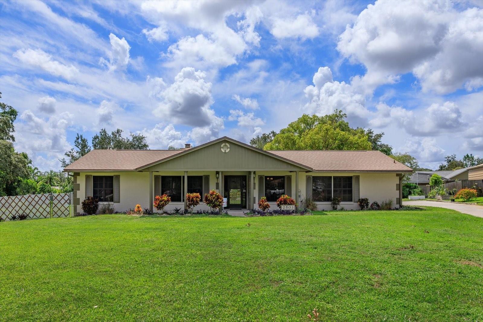 Welcome to this charming single story home offering comfort, space and endless potential. Built in 1980 this residence features 3 bedrooms / 2 bathrooms and sits on over half an acre of private property lined with fruit trees to enjoy. Inside, you will find an inviting layout with a spacious living area and sizeable versatile sunroom, perfect for relaxing or entertaining year-round. The remodeled kitchen features granite counter tops, a large island, newer appliances and plenty of cabinet space. The bedrooms are generously sized for family or guests. Step outside and discover your own backyard retreat, complete with an oversized pool, storage shed which has been used as a workshop and ample room for gardening or outdoor activities. Car enthusiasts and hobbyists will love the 3-car garage. The third bay with barn doors can also be used as a workshop, providing space for projects, tools or extra storage. Located in an ideal location with access to major roadways, this home blends comfort, functionality and outdoor living. Roof 2023, Exterior Paint 2021, Whole House Water Filtration System 2022