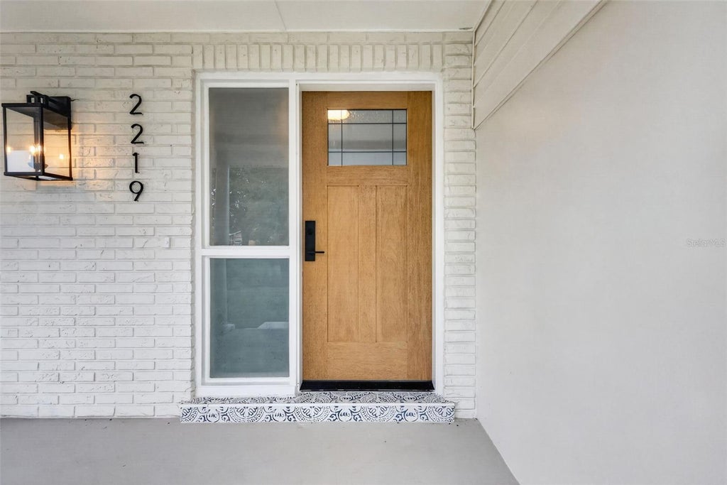 Photo of 2219 Winter Woods Boulevard, Winter Park, FL 32792 (MLS # TB8557964)
